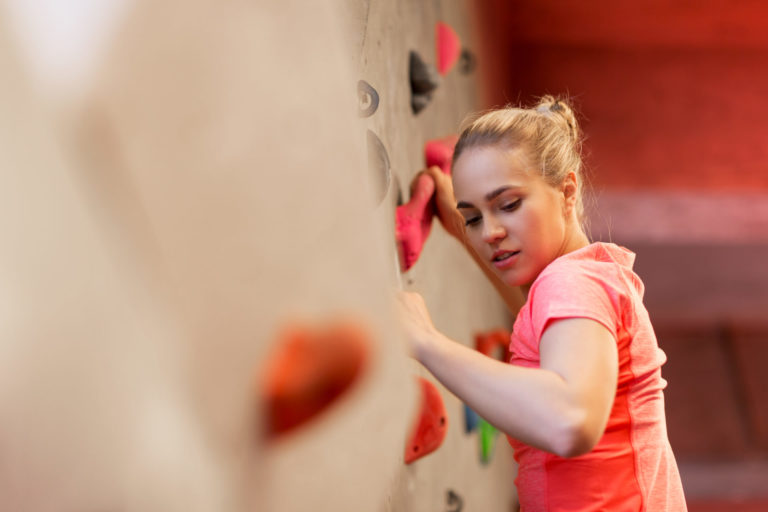 young woman exercising at indoor climbing gym 2021 08 26 22 51 44 utc
